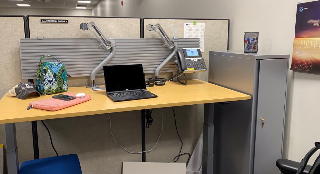 Raised standing desk with minimal items on it